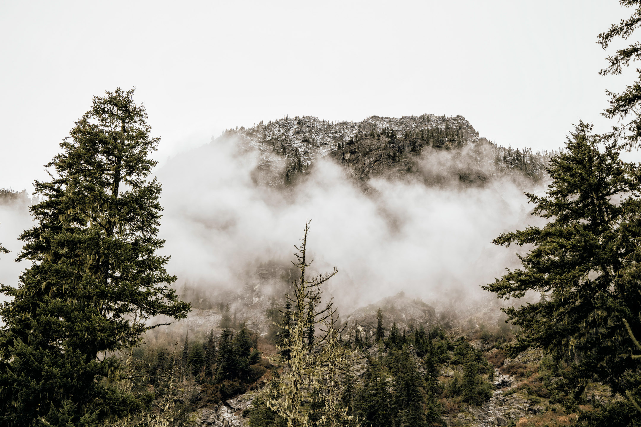 Cascade Mountain adventure engagement session in the snow by James Thomas Long Photography