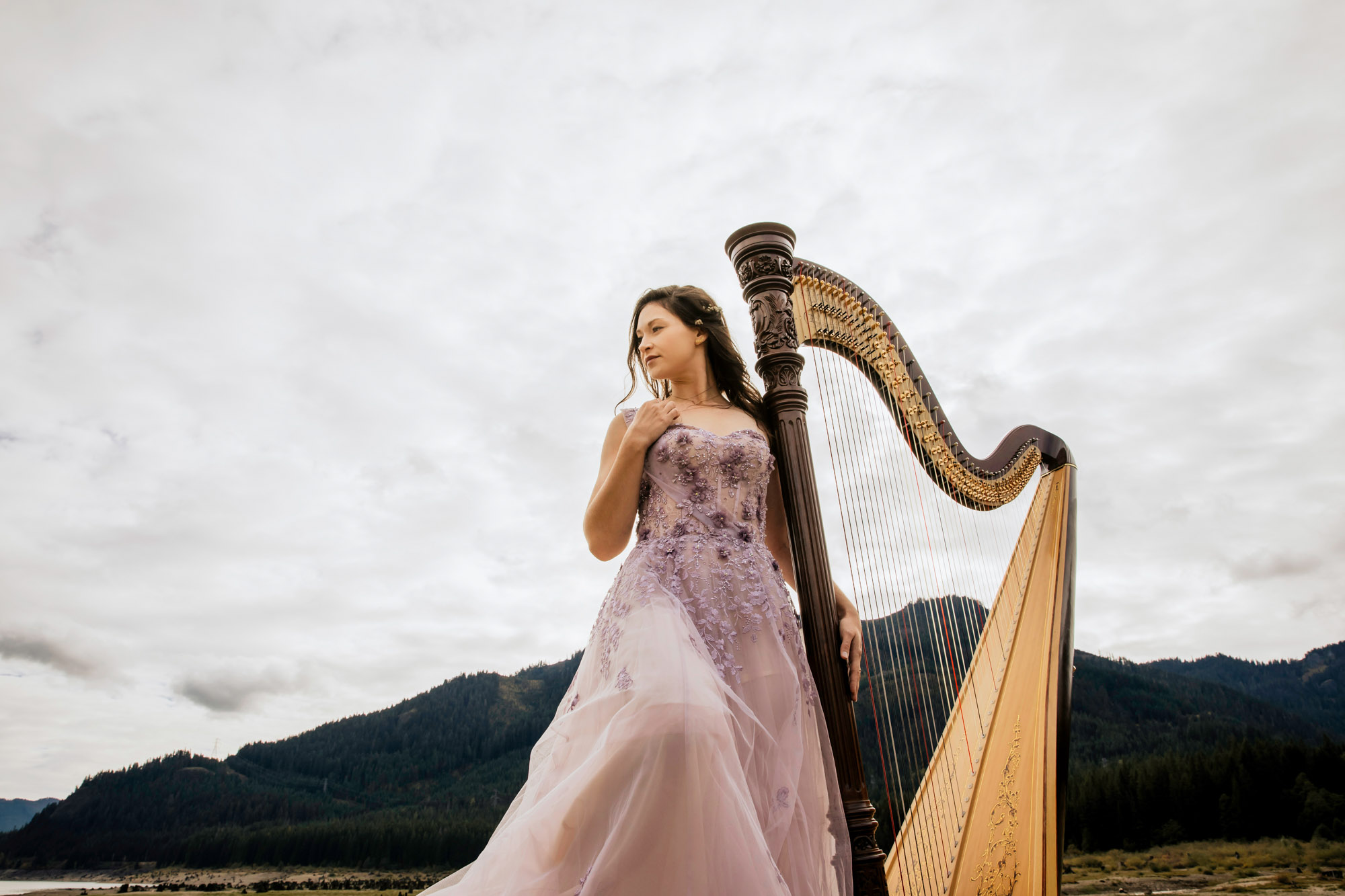 Portrait of a harpist in the Cascade Mountains by Seattle portrait photographer James Thomas Long Photography