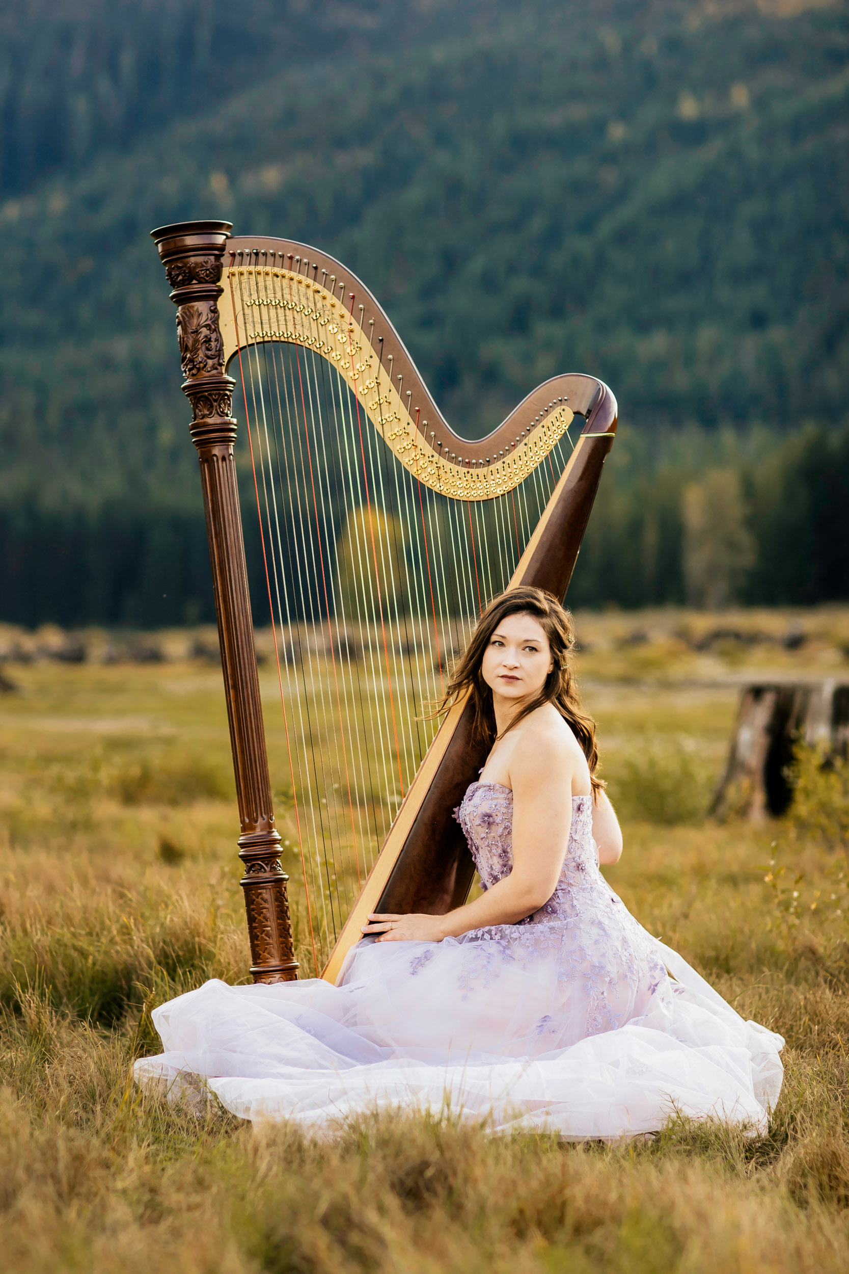 Portrait of a harpist in the Cascade Mountains by Seattle portrait photographer James Thomas Long Photography