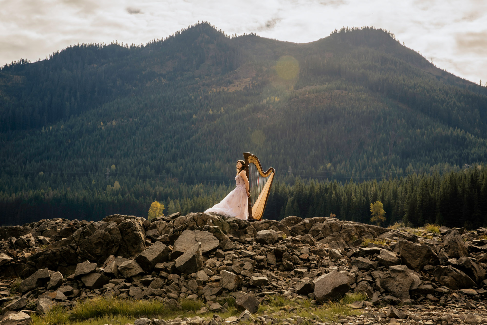 Portrait of a harpist in the Cascade Mountains by Seattle portrait photographer James Thomas Long Photography