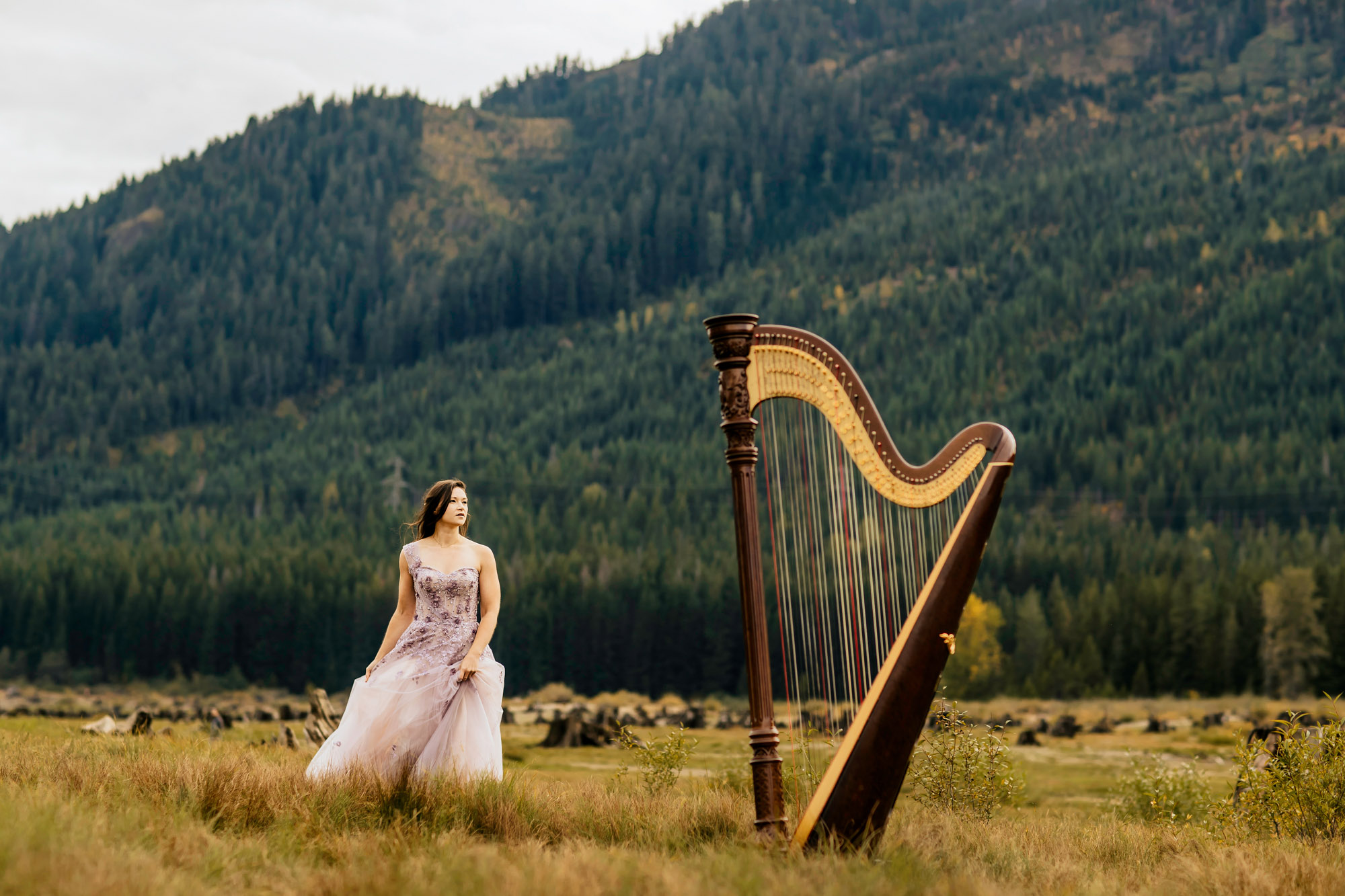 Portrait of a harpist in the Cascade Mountains by Seattle portrait photographer James Thomas Long Photography