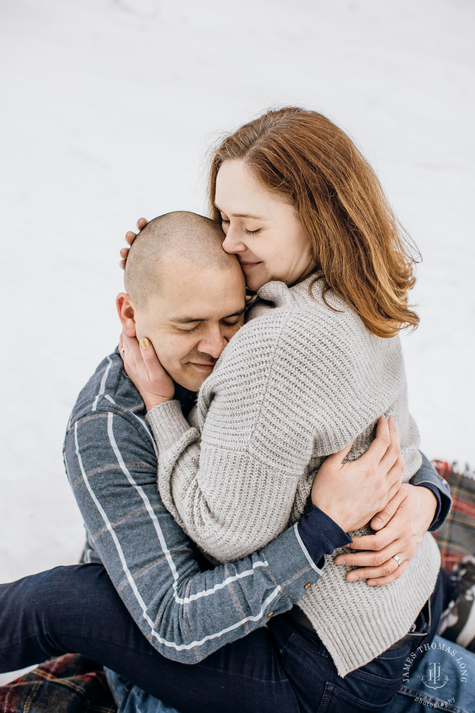 Cascade Mountain snowshoeing adventure engagement session in the snow by Snoqualmie wedding photographer James Thomas Long Photography