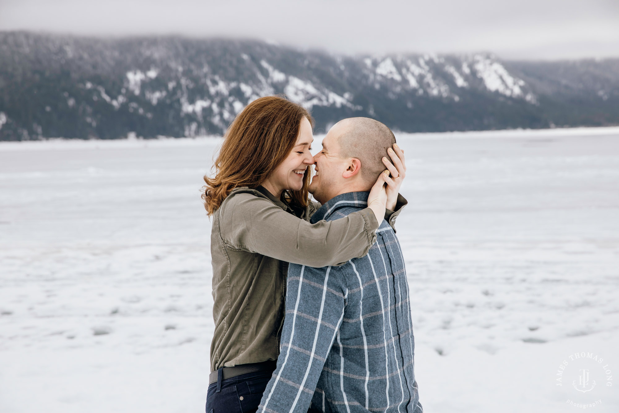 Cascade Mountain snowshoeing adventure engagement session in the snow by Snoqualmie wedding photographer James Thomas Long Photography