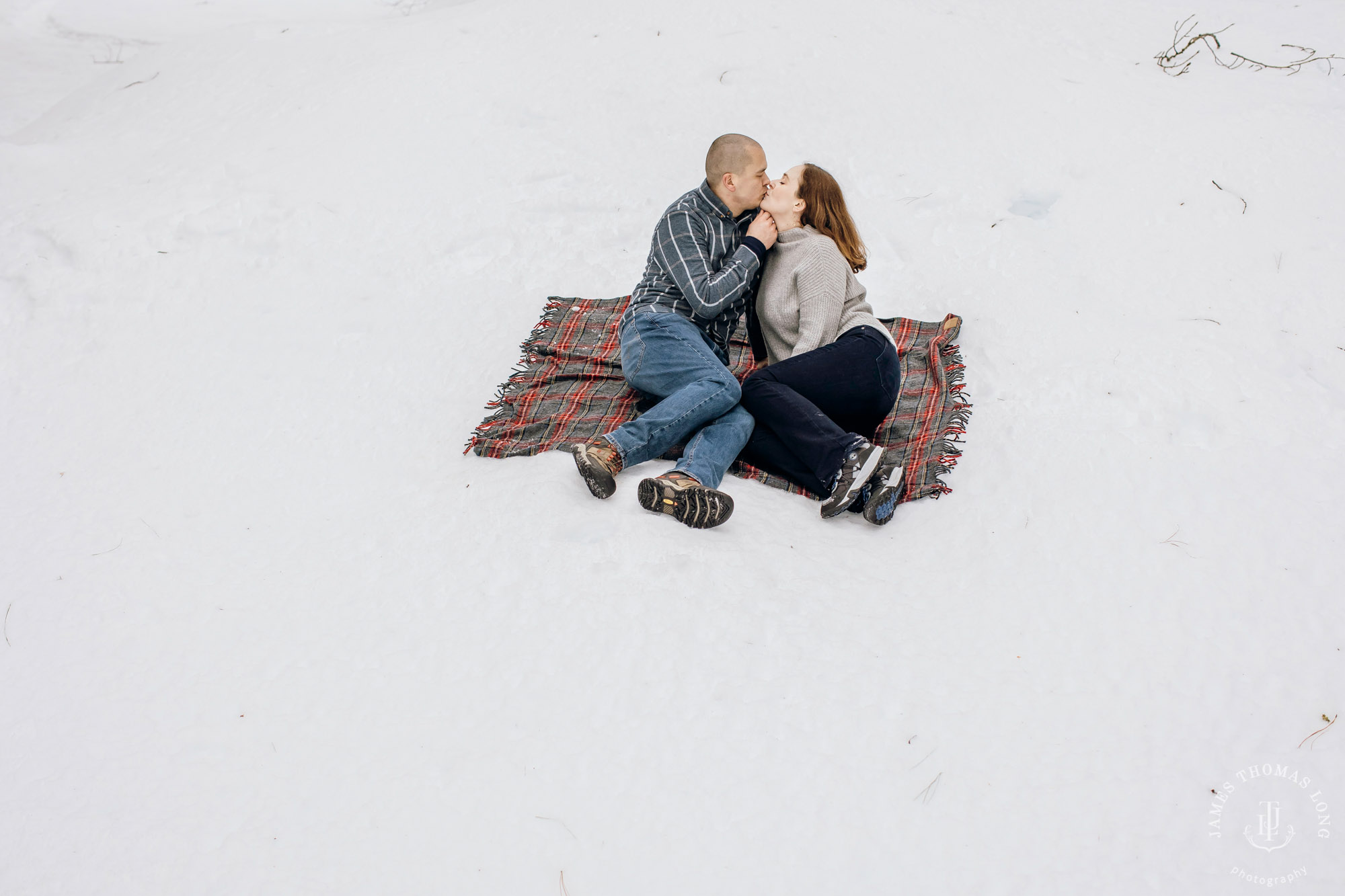 Cascade Mountain snowshoeing adventure engagement session in the snow by Snoqualmie wedding photographer James Thomas Long Photography