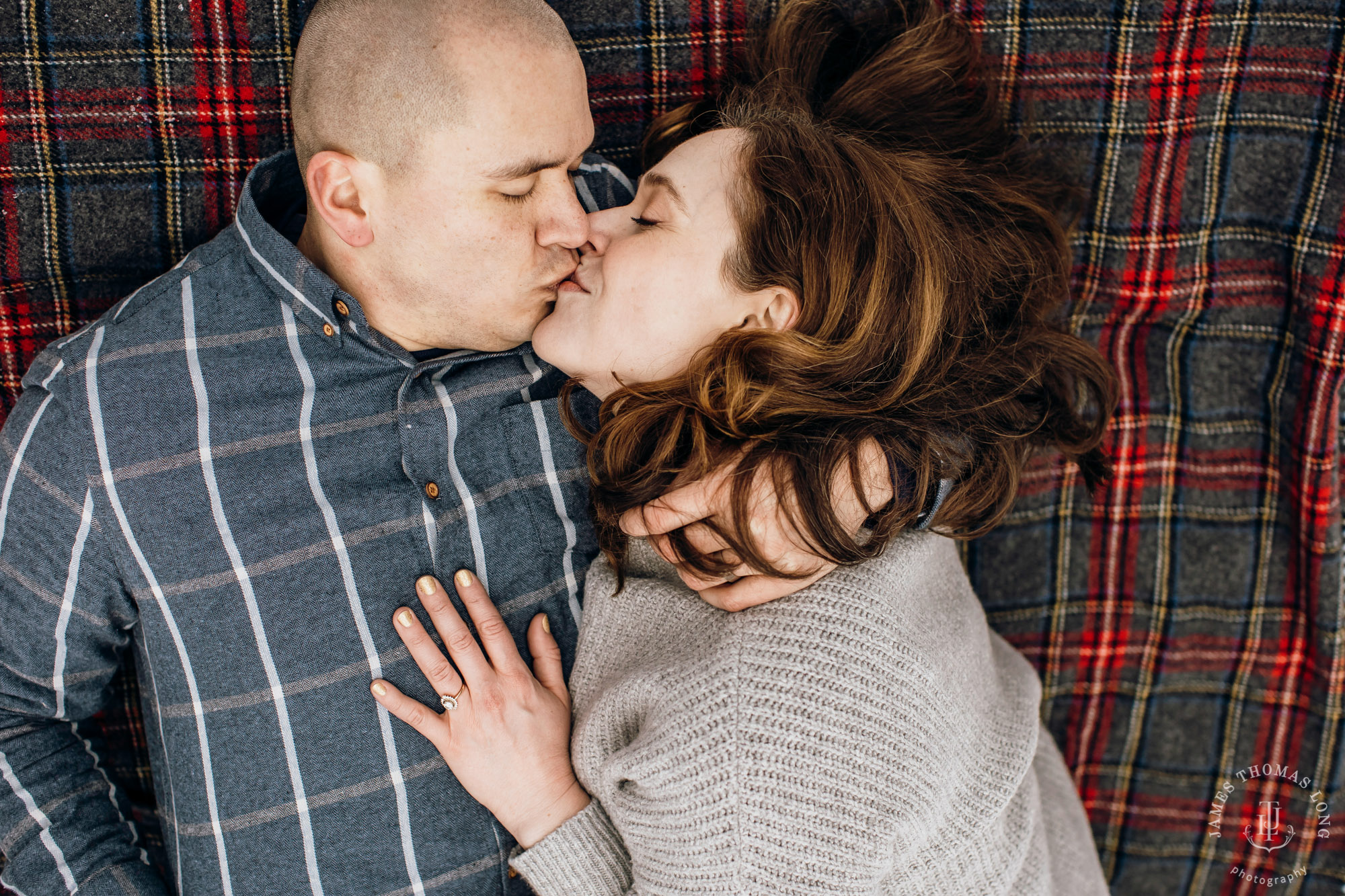 Cascade Mountain snowshoeing adventure engagement session in the snow by Snoqualmie wedding photographer James Thomas Long Photography