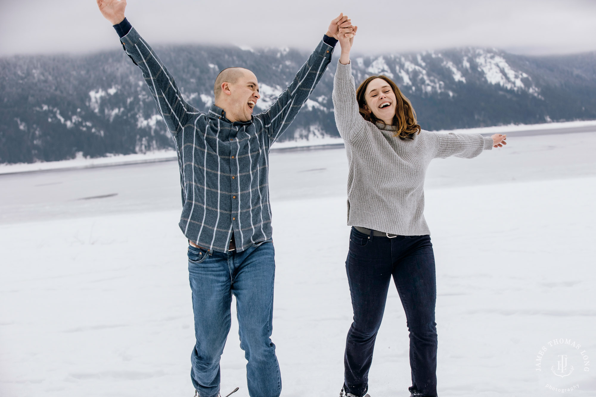 Cascade Mountain snowshoeing adventure engagement session in the snow by Snoqualmie wedding photographer James Thomas Long Photography