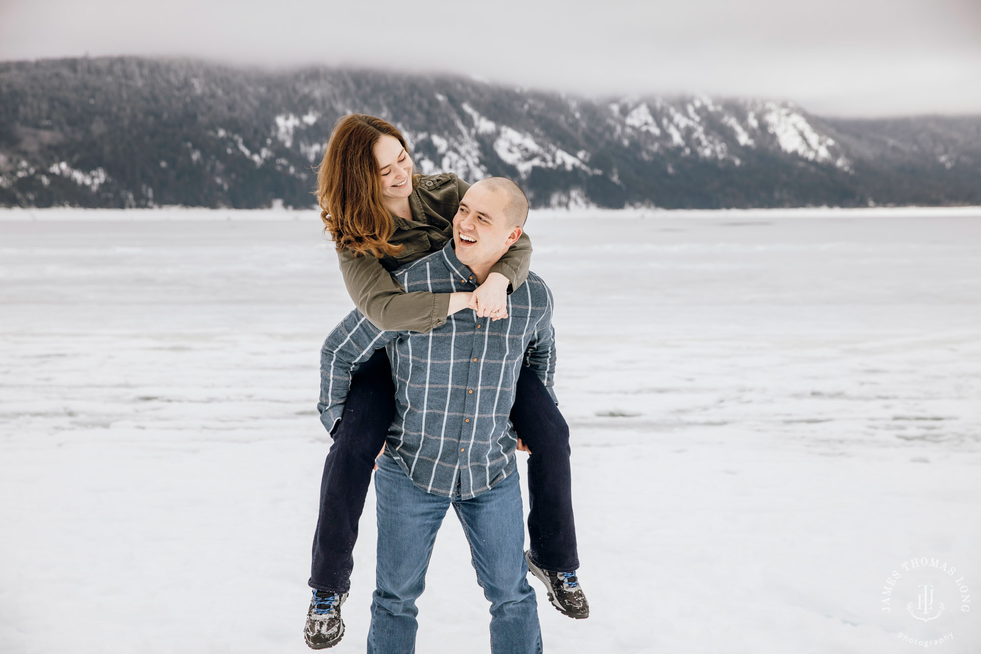 Cascade Mountain snowshoeing adventure engagement session in the snow by Snoqualmie wedding photographer James Thomas Long Photography