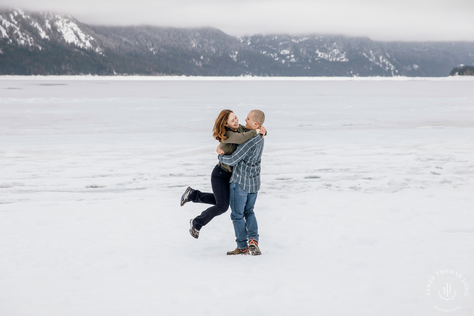 Cascade Mountain snowshoeing adventure engagement session in the snow by Snoqualmie wedding photographer James Thomas Long Photography