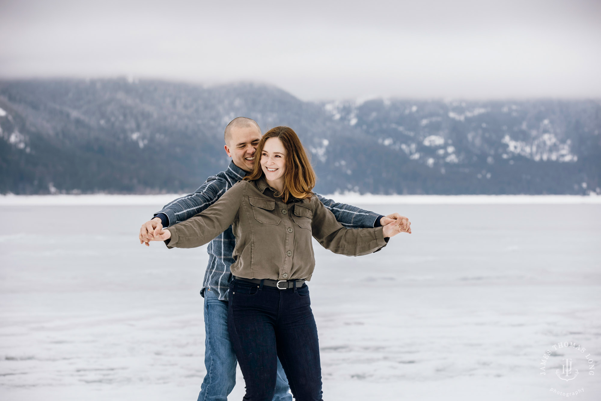 Cascade Mountain snowshoeing adventure engagement session in the snow by Snoqualmie wedding photographer James Thomas Long Photography