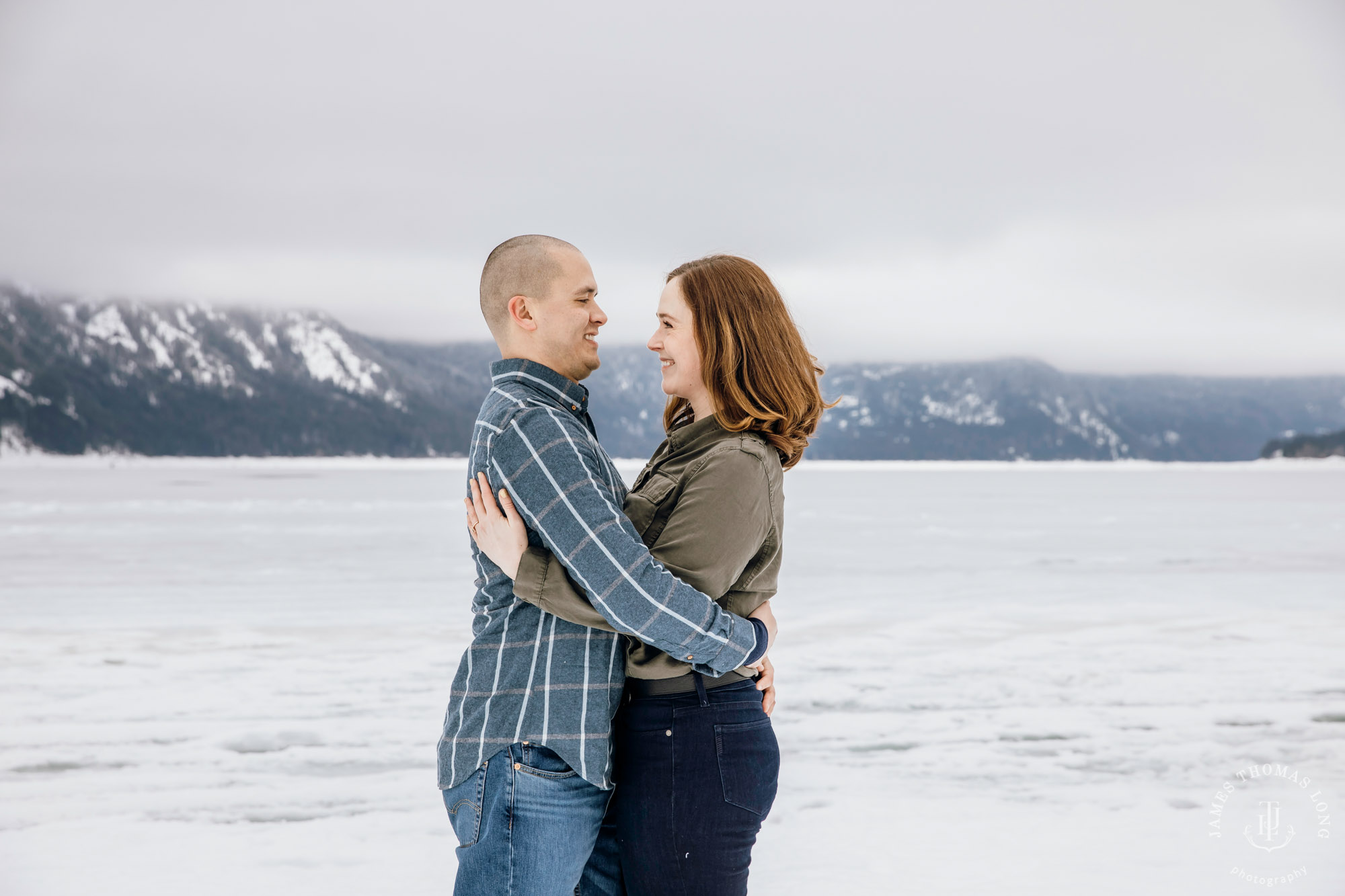 Cascade Mountain snowshoeing adventure engagement session in the snow by Snoqualmie wedding photographer James Thomas Long Photography