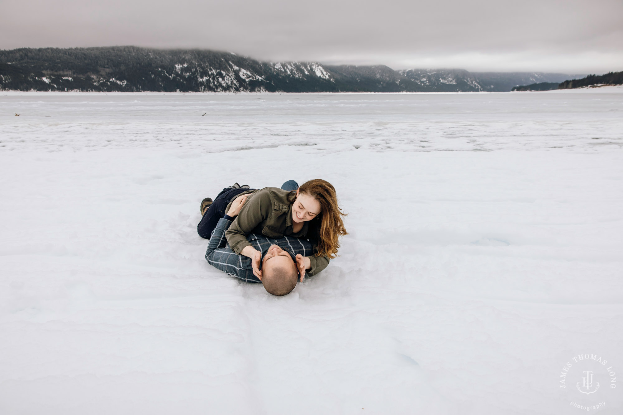 Cascade Mountain snowshoeing adventure engagement session in the snow by Snoqualmie wedding photographer James Thomas Long Photography