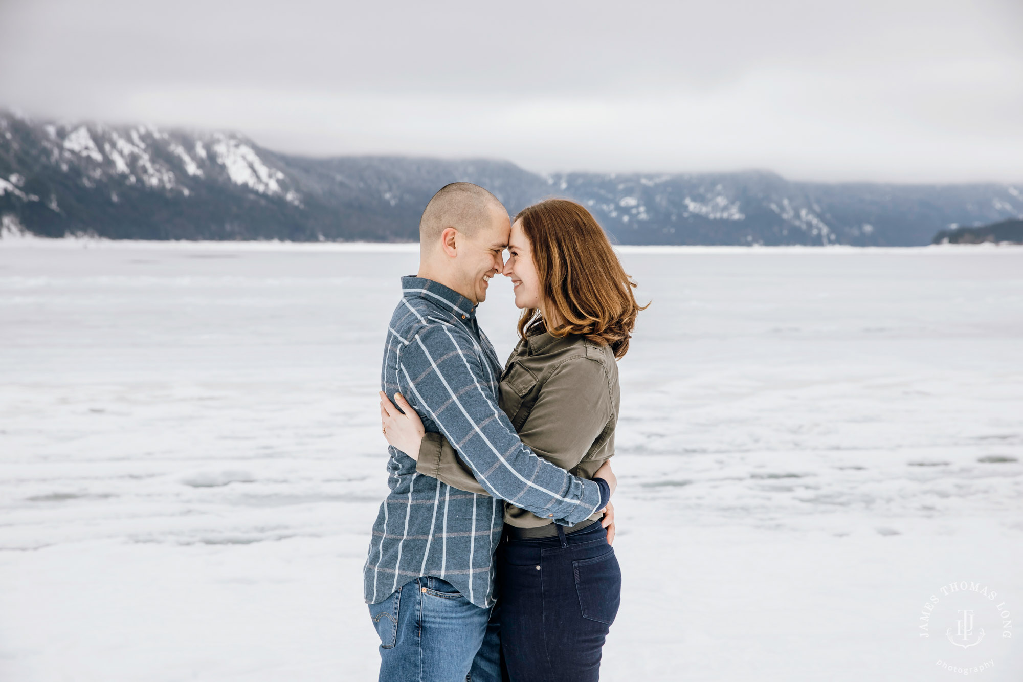 Cascade Mountain snowshoeing adventure engagement session in the snow by Snoqualmie wedding photographer James Thomas Long Photography