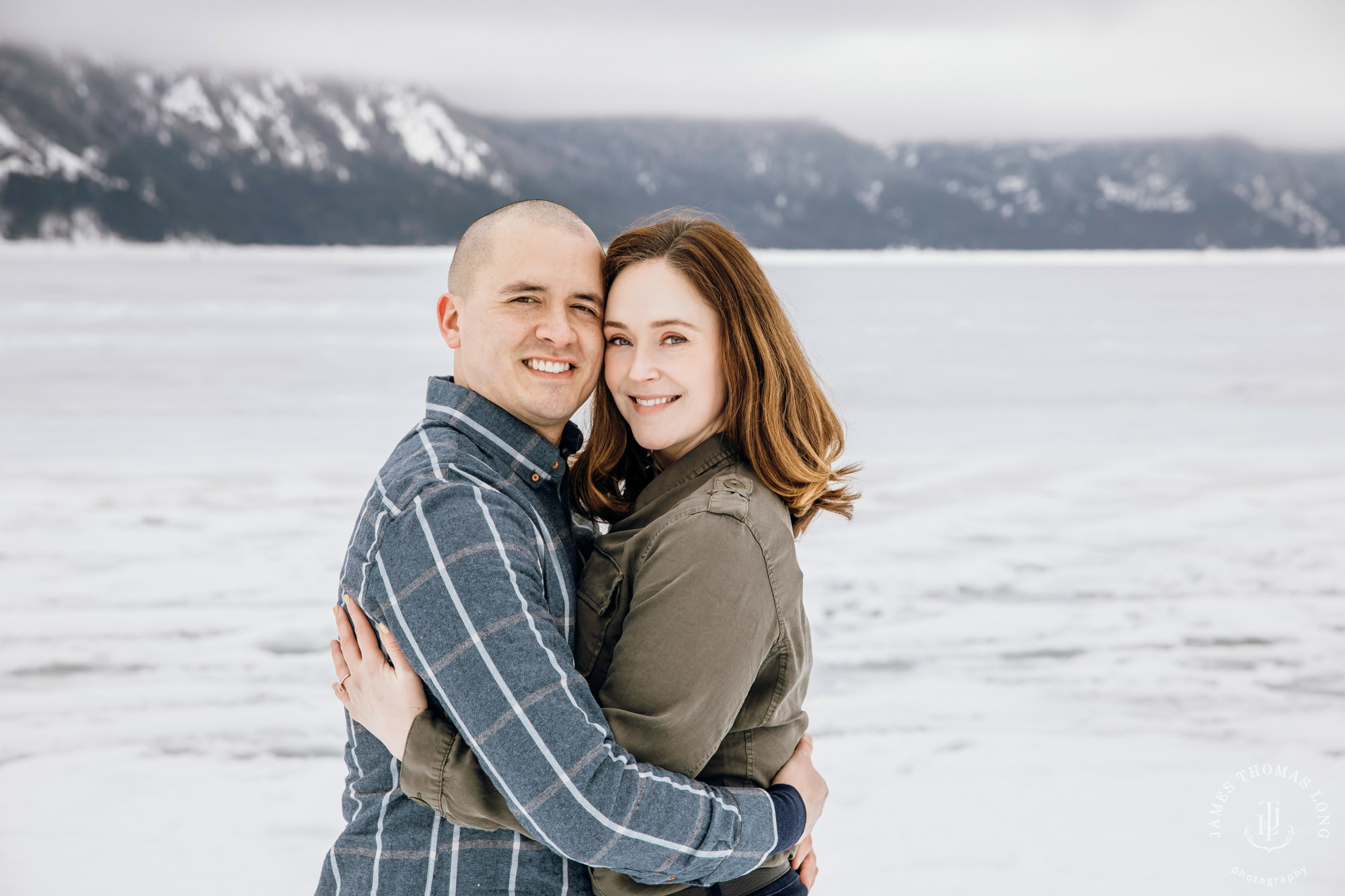 Cascade Mountain snowshoeing adventure engagement session in the snow by Snoqualmie wedding photographer James Thomas Long Photography