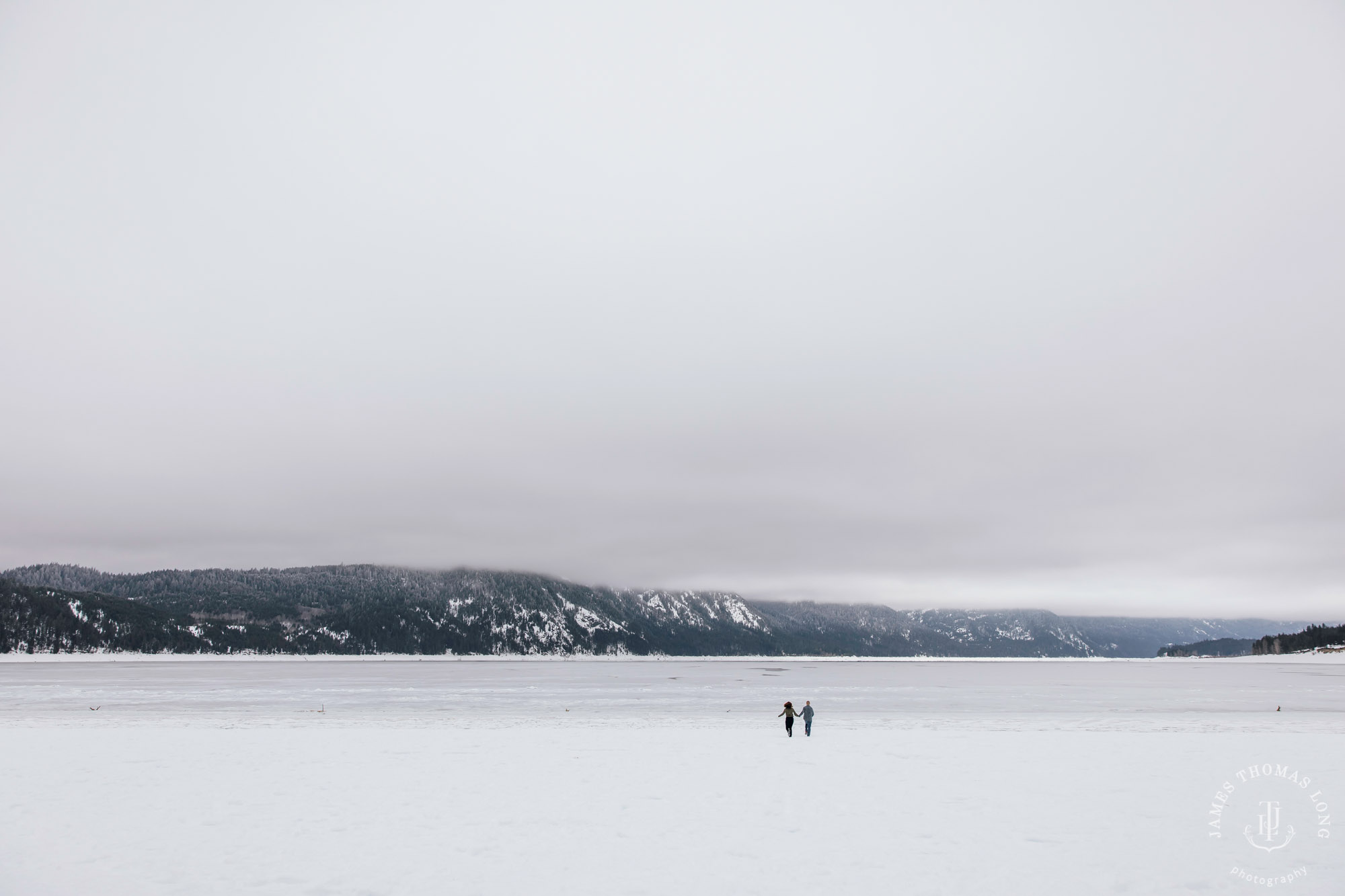 Cascade Mountain snowshoeing adventure engagement session in the snow by Snoqualmie wedding photographer James Thomas Long Photography