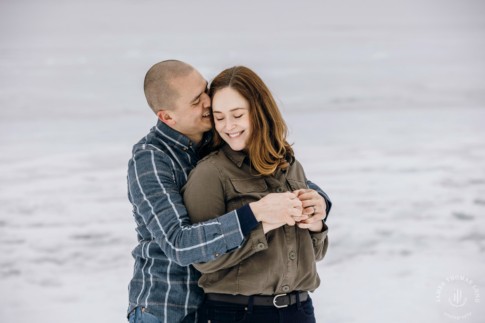 Cascade Mountain snowshoeing adventure engagement session in the snow by Snoqualmie wedding photographer James Thomas Long Photography