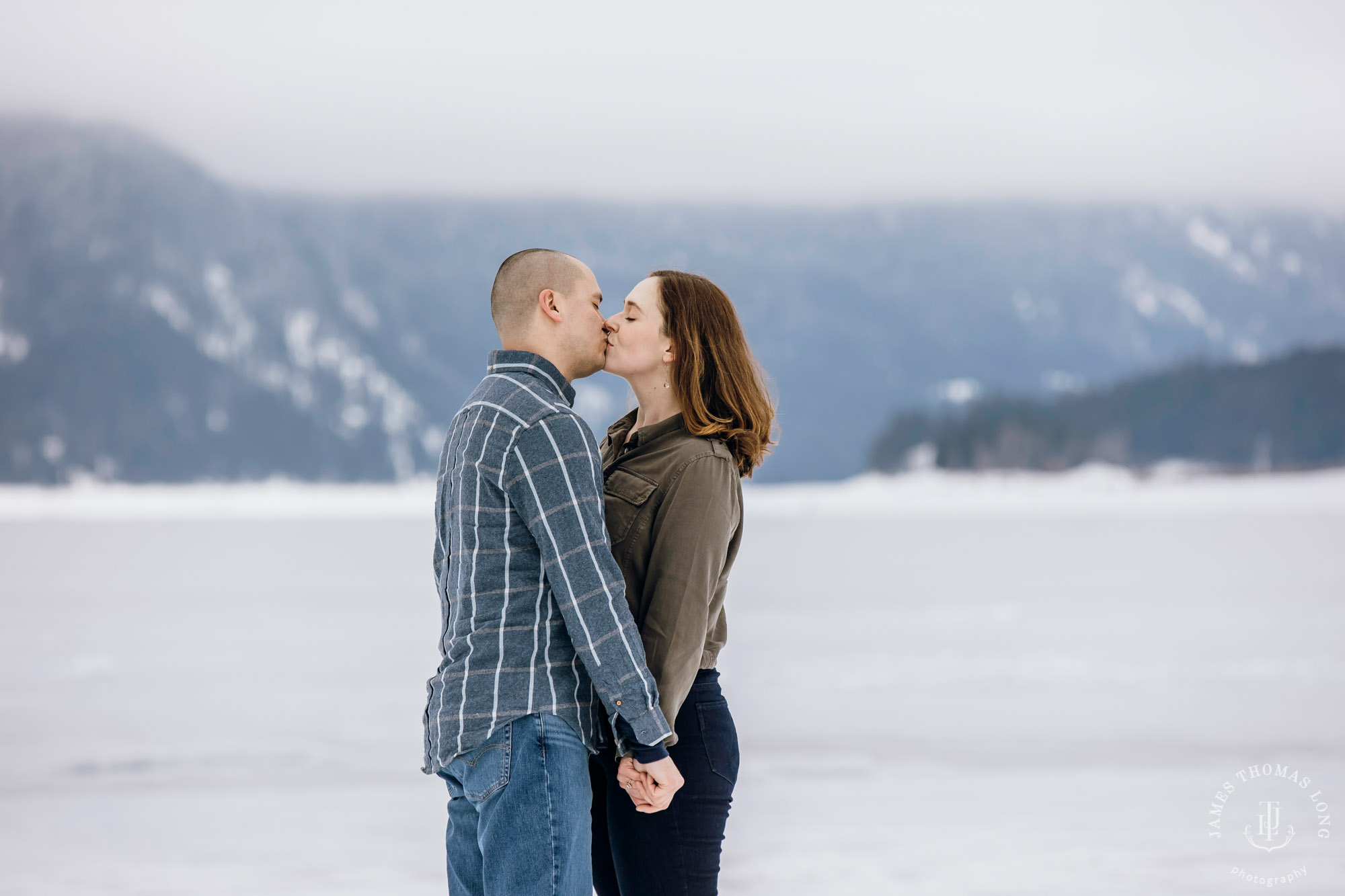 Cascade Mountain snowshoeing adventure engagement session in the snow by Snoqualmie wedding photographer James Thomas Long Photography