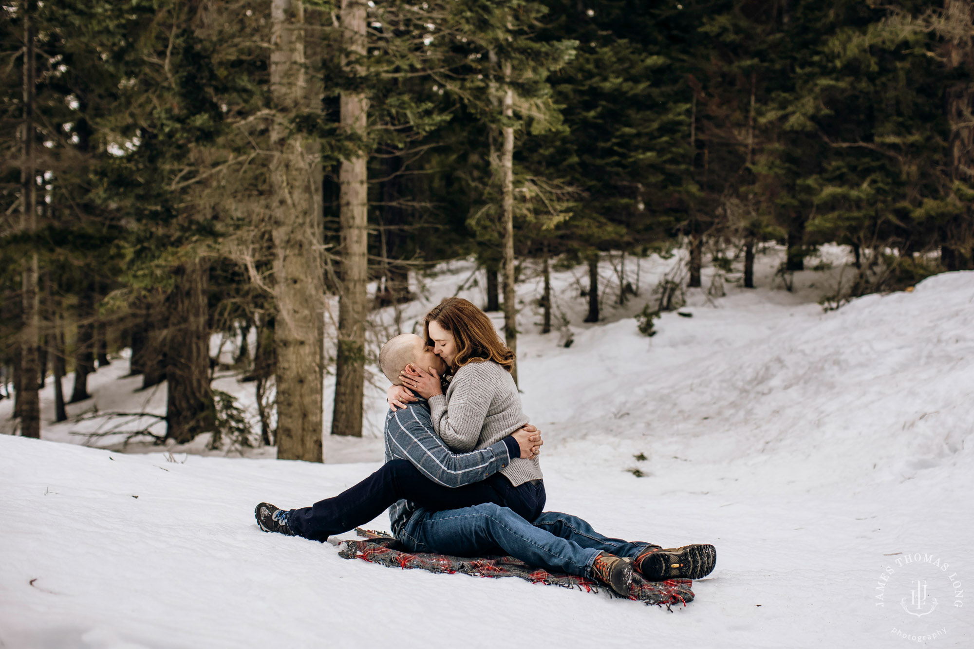 Cascade Mountain snowshoeing adventure engagement session in the snow by Snoqualmie wedding photographer James Thomas Long Photography