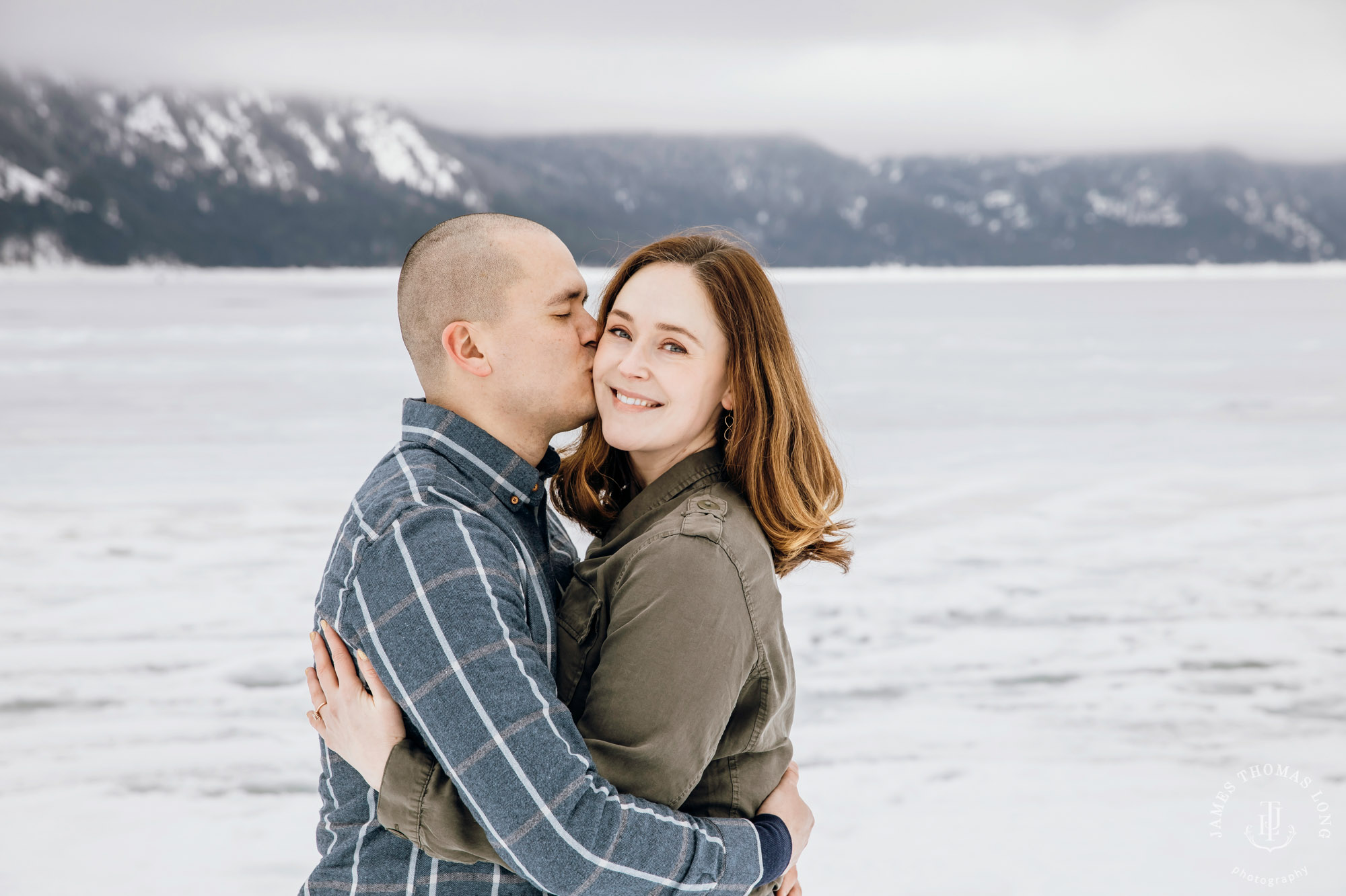 Cascade Mountain snowshoeing adventure engagement session in the snow by Snoqualmie wedding photographer James Thomas Long Photography