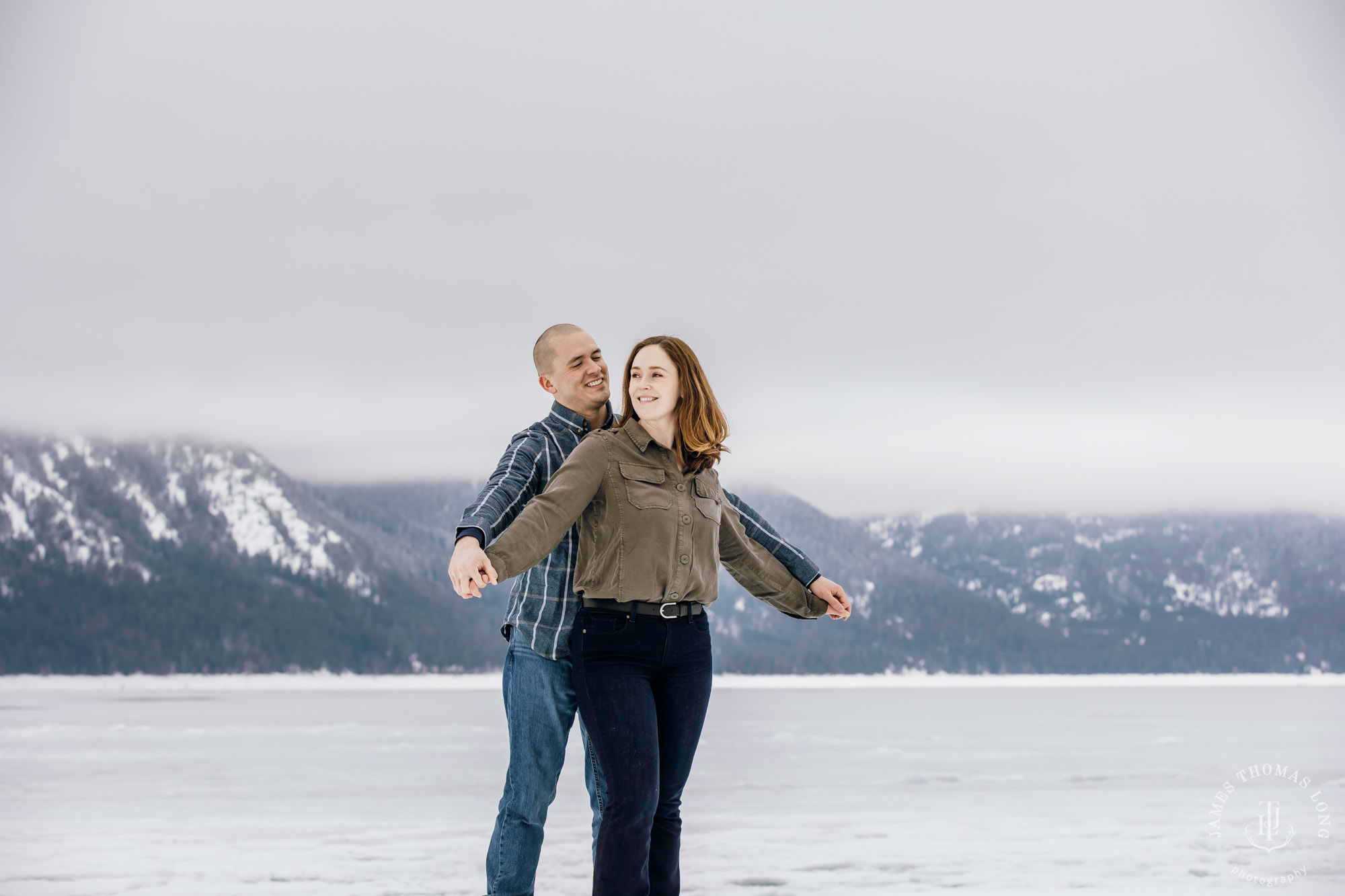 Cascade Mountain snowshoeing adventure engagement session in the snow by Snoqualmie wedding photographer James Thomas Long Photography