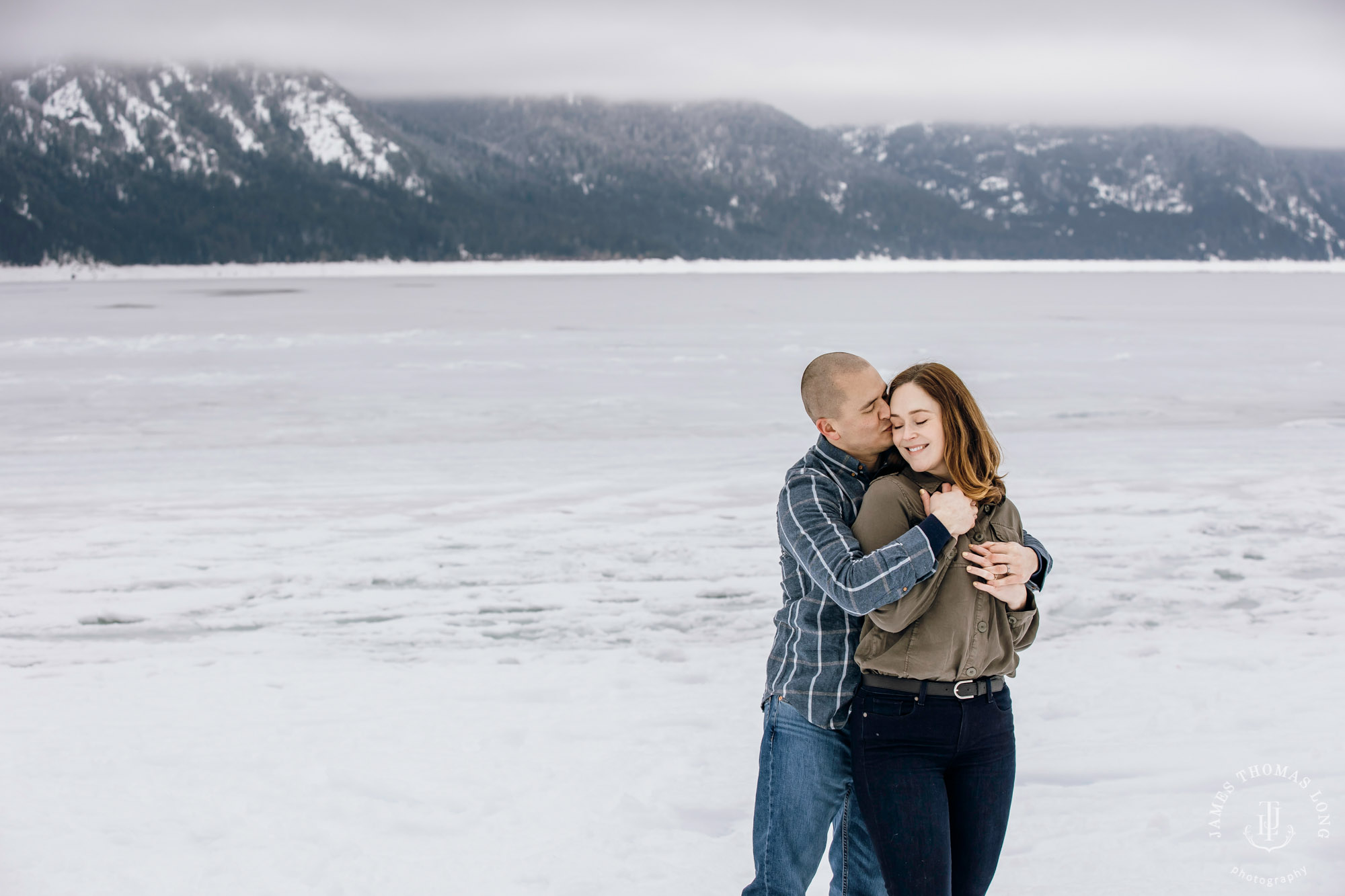 Cascade Mountain snowshoeing adventure engagement session in the snow by Snoqualmie wedding photographer James Thomas Long Photography