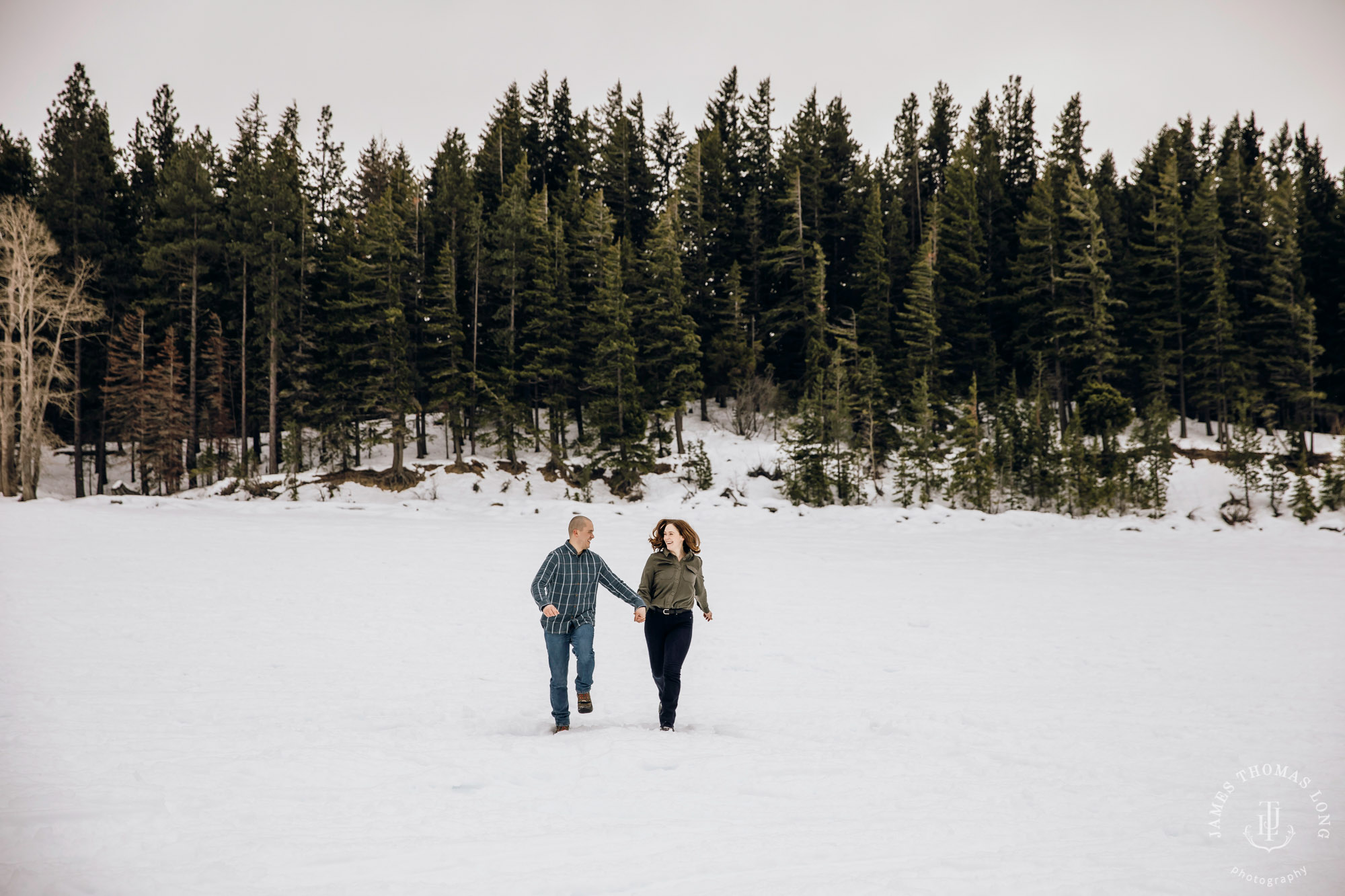 Cascade Mountain snowshoeing adventure engagement session in the snow by Snoqualmie wedding photographer James Thomas Long Photography