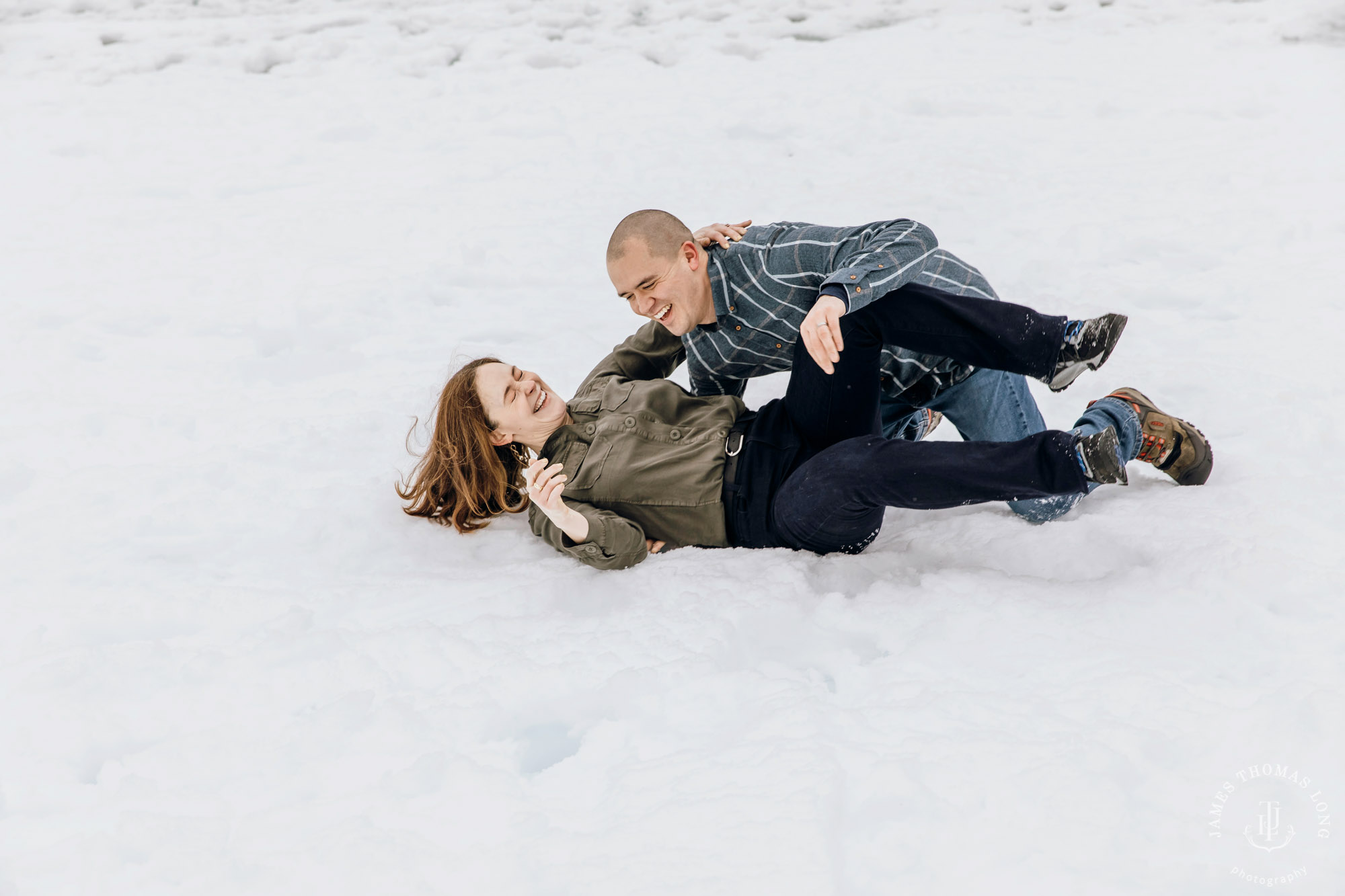 Cascade Mountain snowshoeing adventure engagement session in the snow by Snoqualmie wedding photographer James Thomas Long Photography