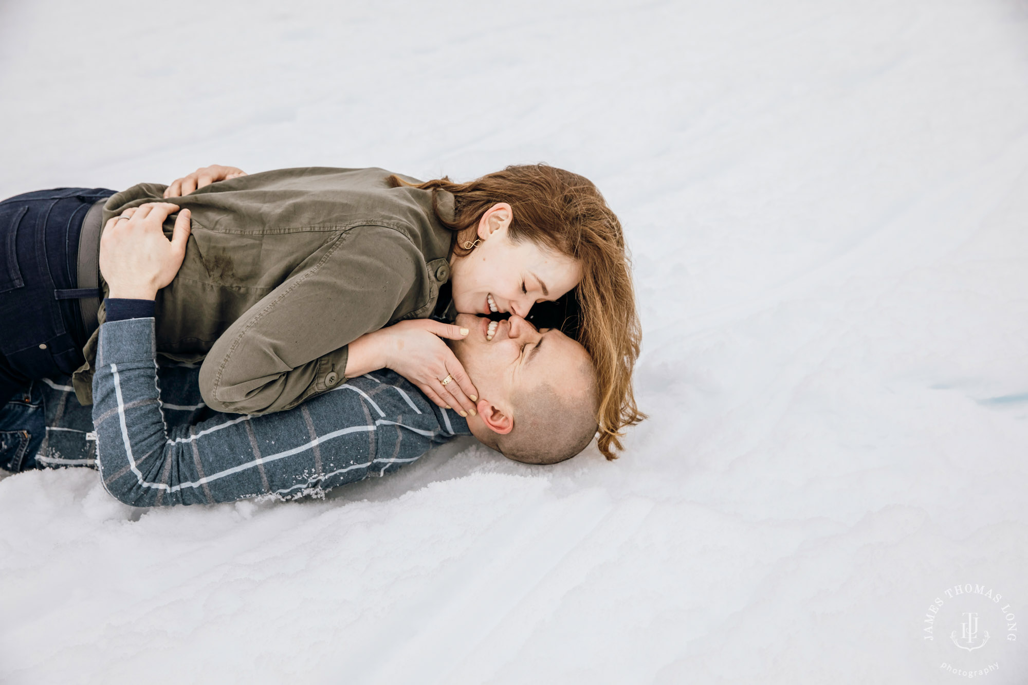 Cascade Mountain snowshoeing adventure engagement session in the snow by Snoqualmie wedding photographer James Thomas Long Photography