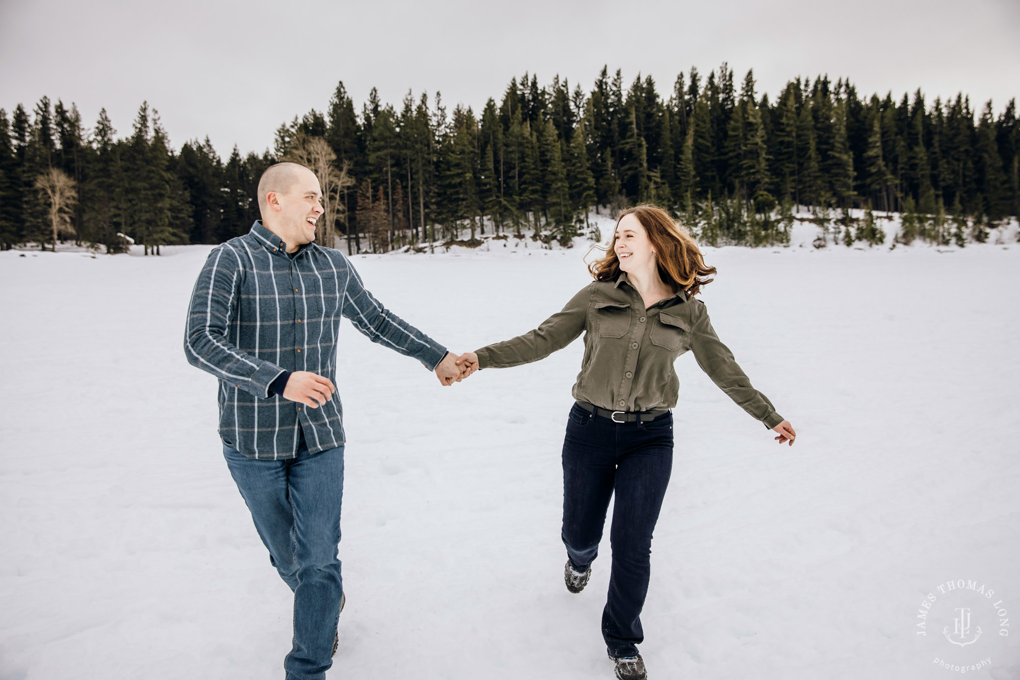 Cascade Mountain snowshoeing adventure engagement session in the snow by Snoqualmie wedding photographer James Thomas Long Photography