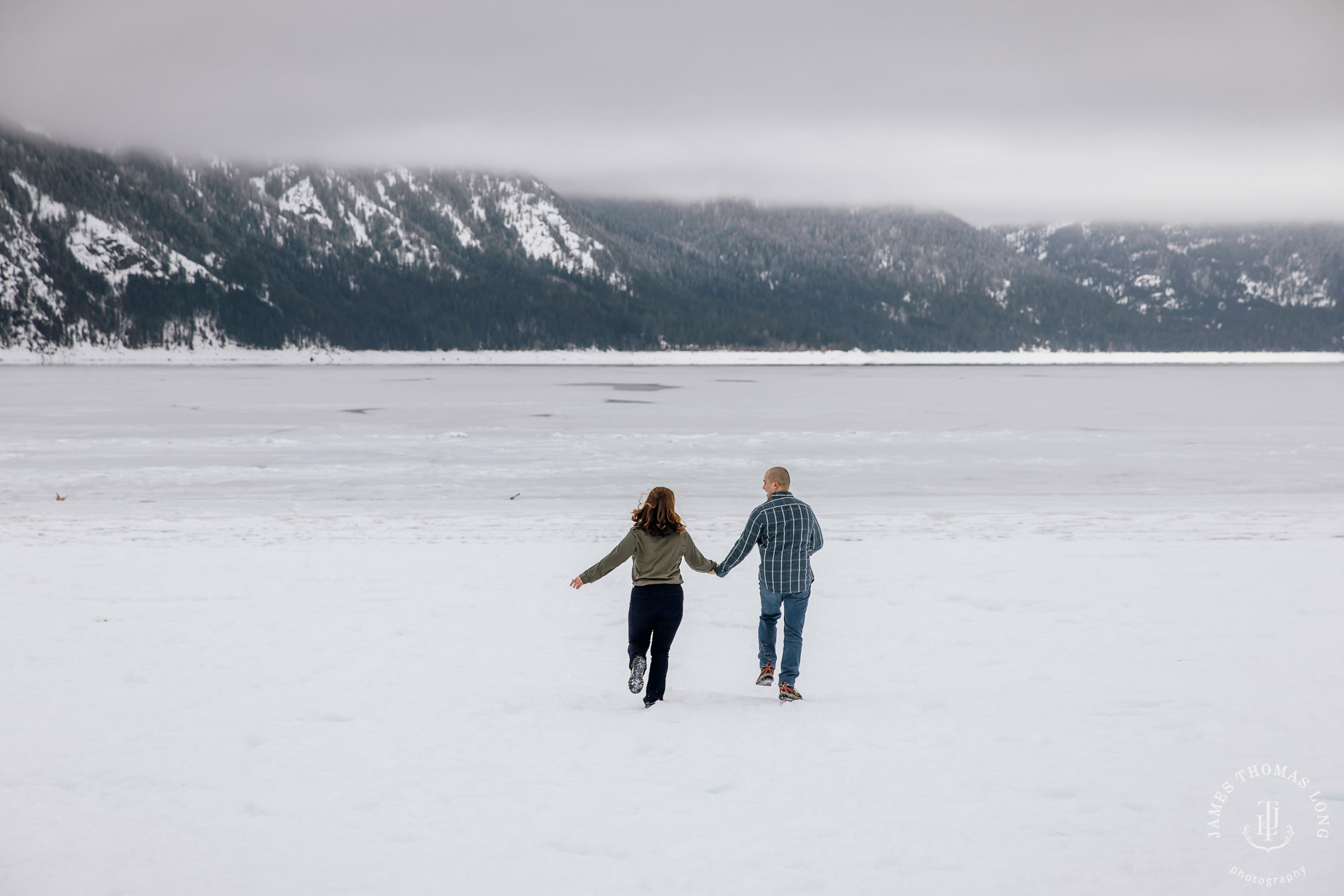 Cascade Mountain snowshoeing adventure engagement session in the snow by Snoqualmie wedding photographer James Thomas Long Photography