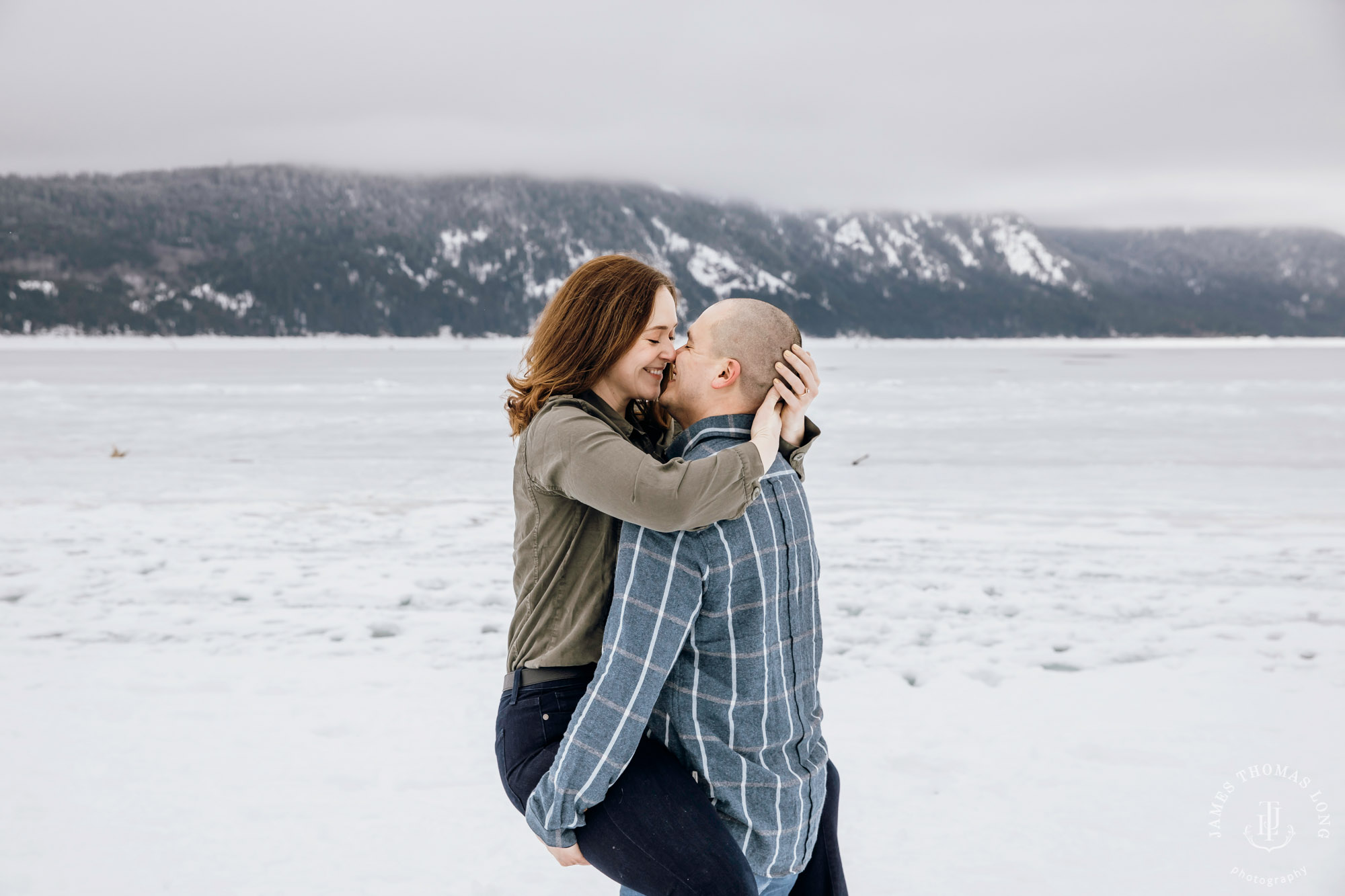 Cascade Mountain snowshoeing adventure engagement session in the snow by Snoqualmie wedding photographer James Thomas Long Photography