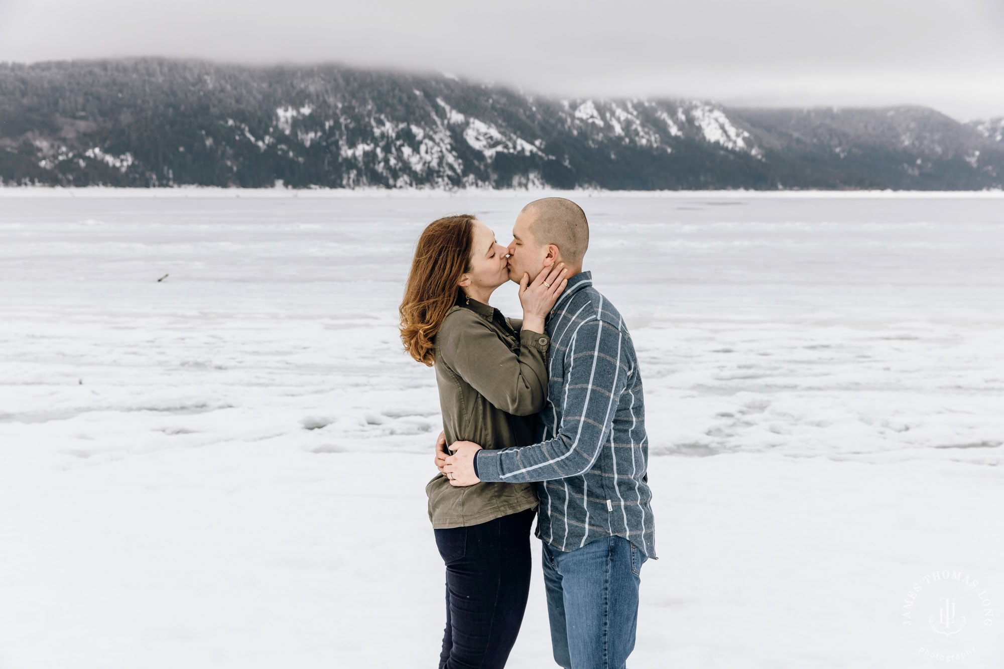 Cascade Mountain snowshoeing adventure engagement session in the snow by Snoqualmie wedding photographer James Thomas Long Photography