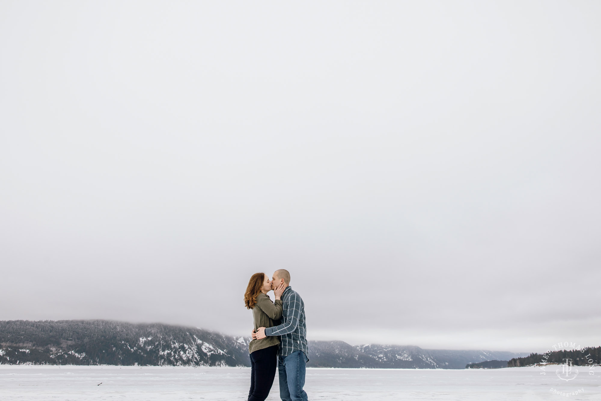 Cascade Mountain snowshoeing adventure engagement session in the snow by Snoqualmie wedding photographer James Thomas Long Photography