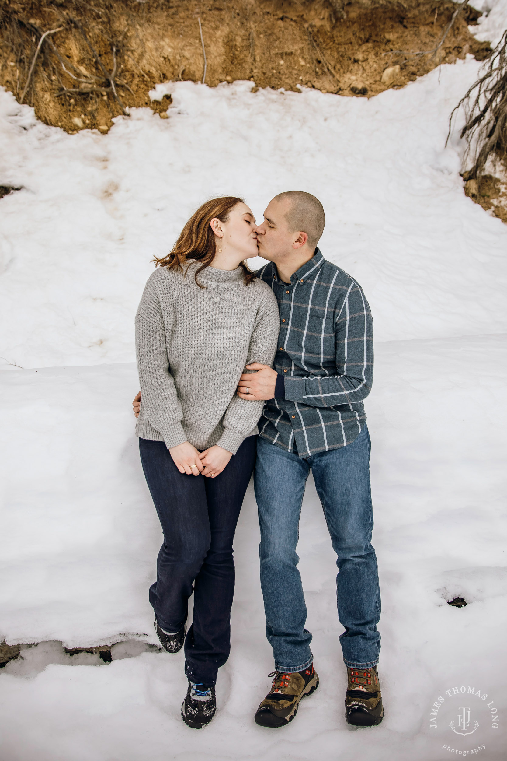 Cascade Mountain snowshoeing adventure engagement session in the snow by Snoqualmie wedding photographer James Thomas Long Photography