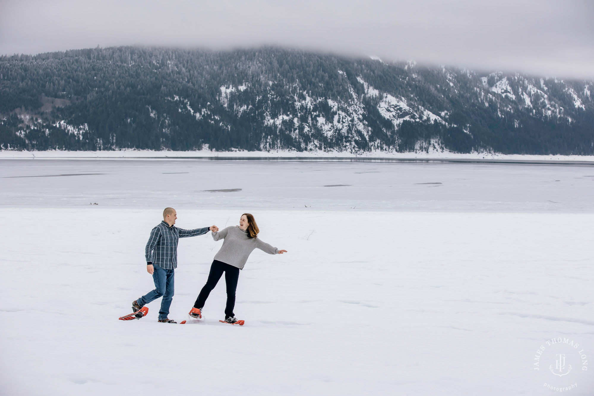 Cascade Mountain snowshoeing adventure engagement session in the snow by Snoqualmie wedding photographer James Thomas Long Photography