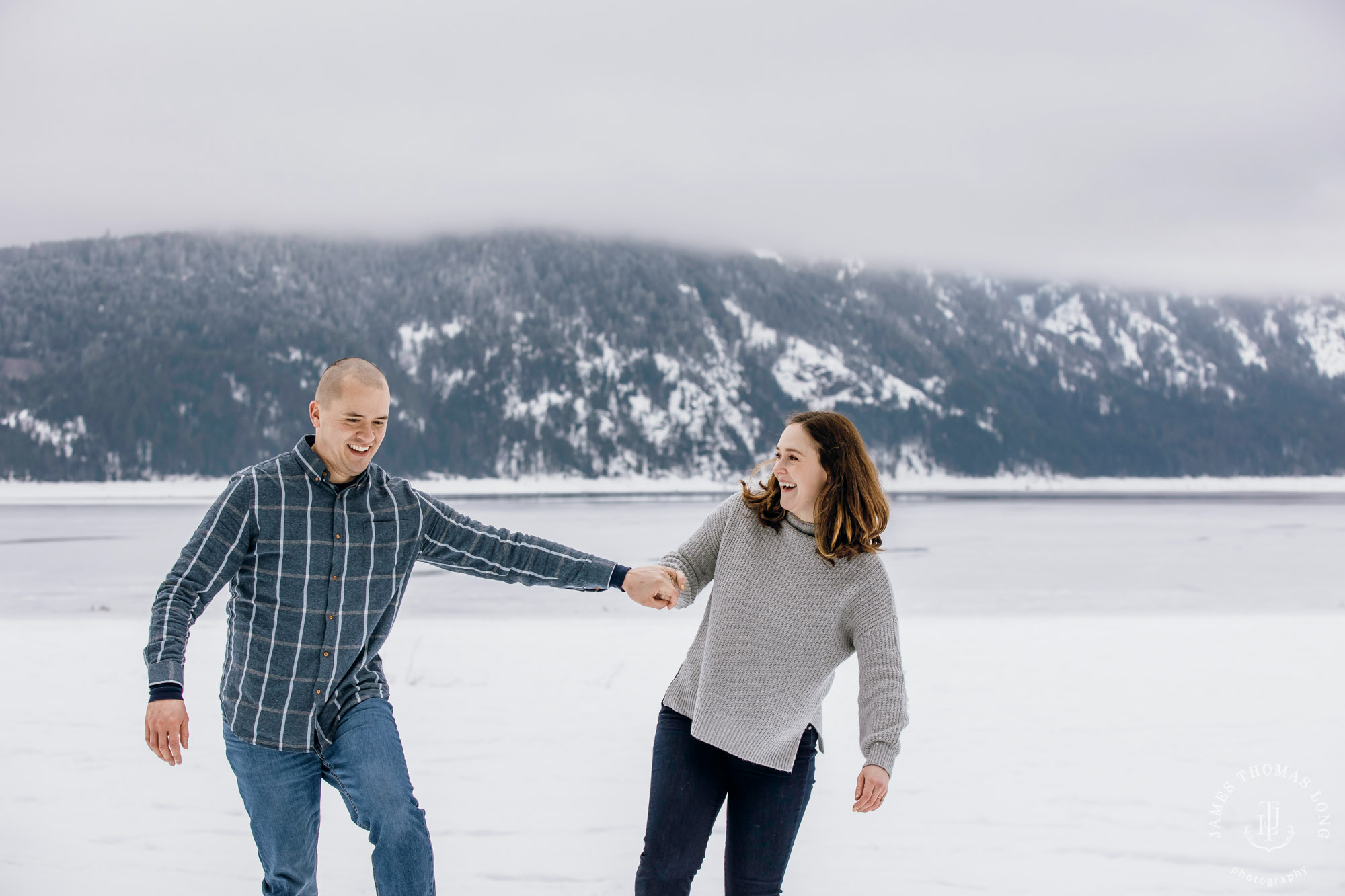 Cascade Mountain snowshoeing adventure engagement session in the snow by Snoqualmie wedding photographer James Thomas Long Photography