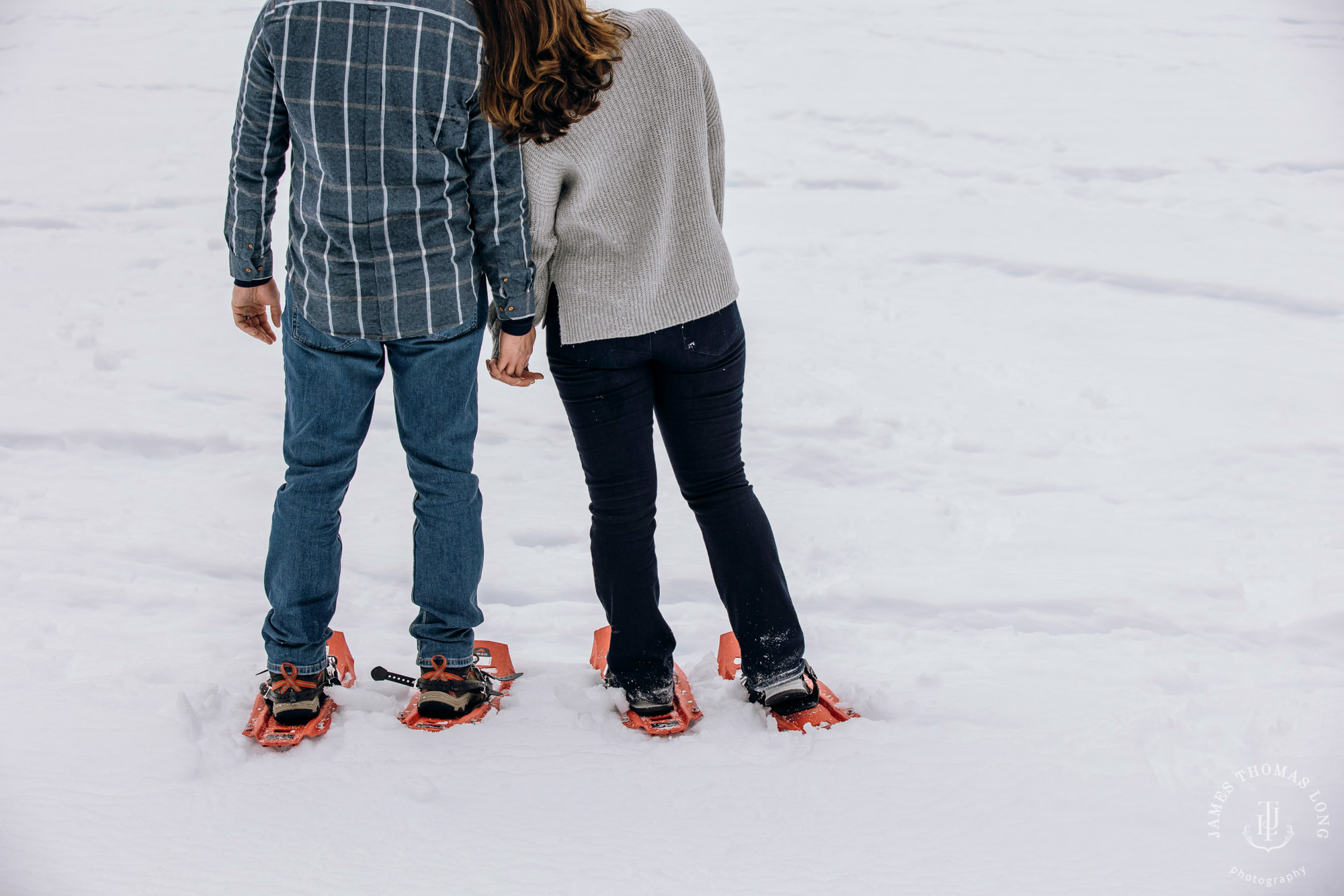 Cascade Mountain snowshoeing adventure engagement session in the snow by Snoqualmie wedding photographer James Thomas Long Photography