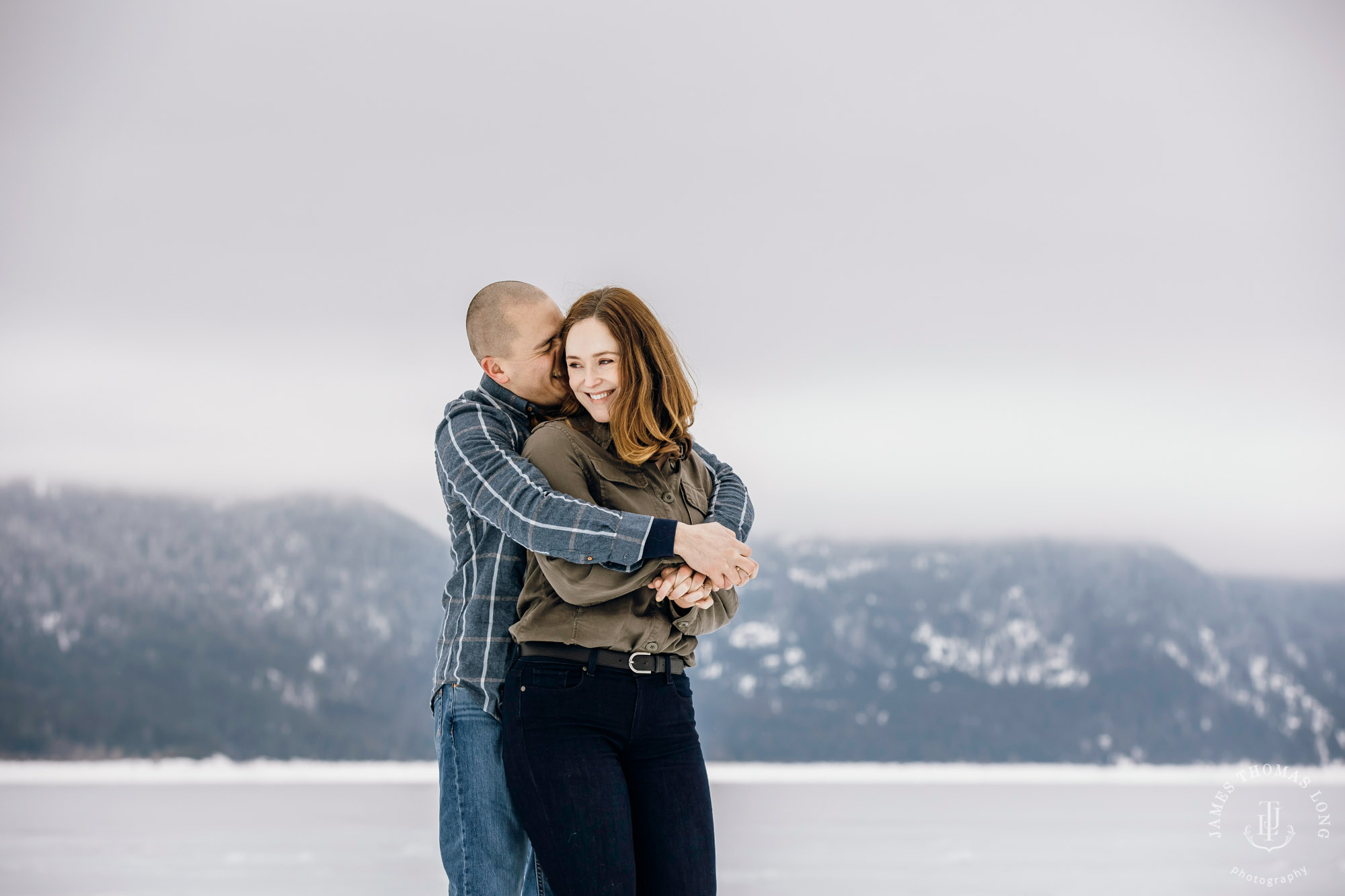 Cascade Mountain snowshoeing adventure engagement session in the snow by Snoqualmie wedding photographer James Thomas Long Photography