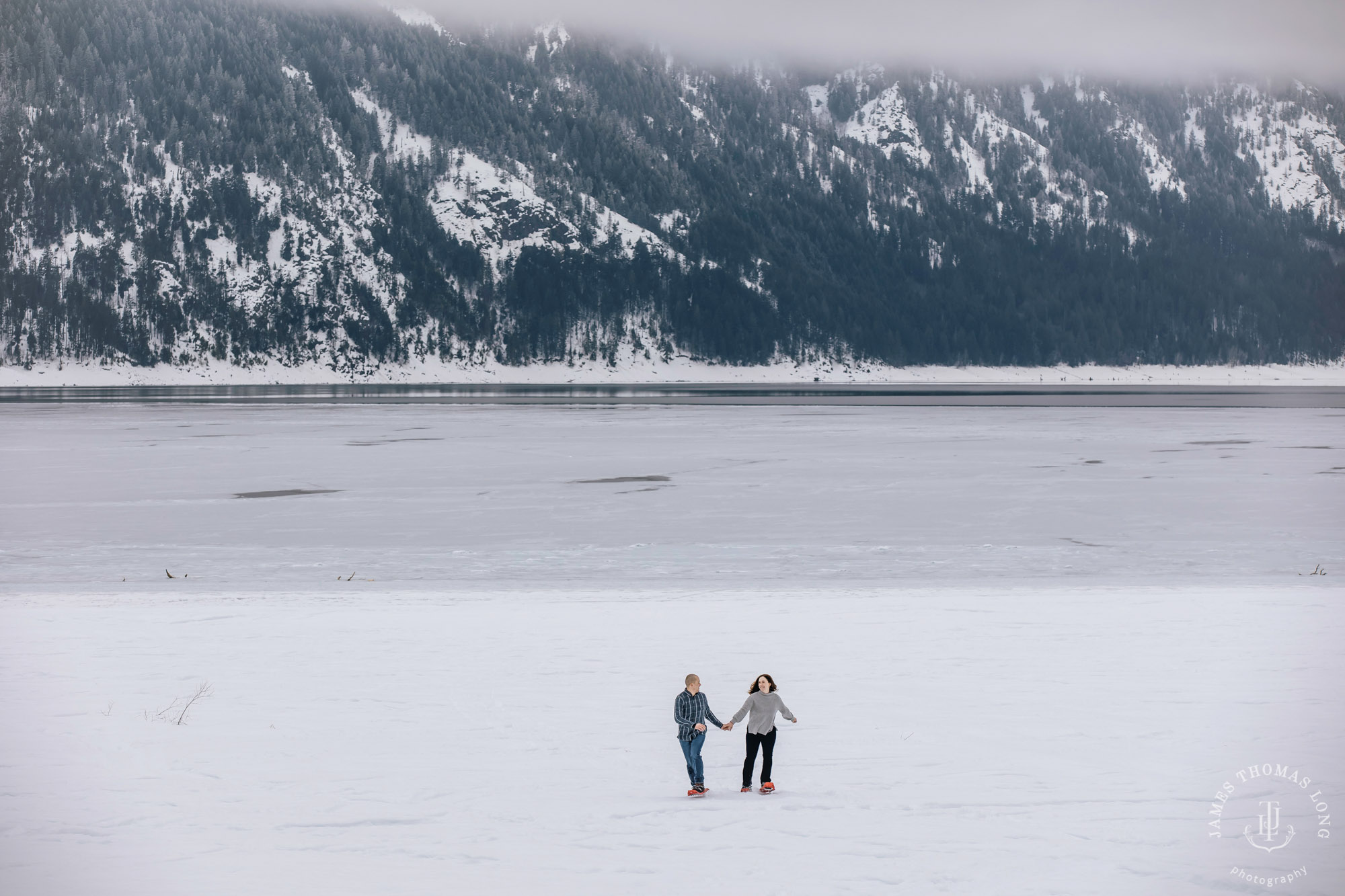 Cascade Mountain snowshoeing adventure engagement session in the snow by Snoqualmie wedding photographer James Thomas Long Photography